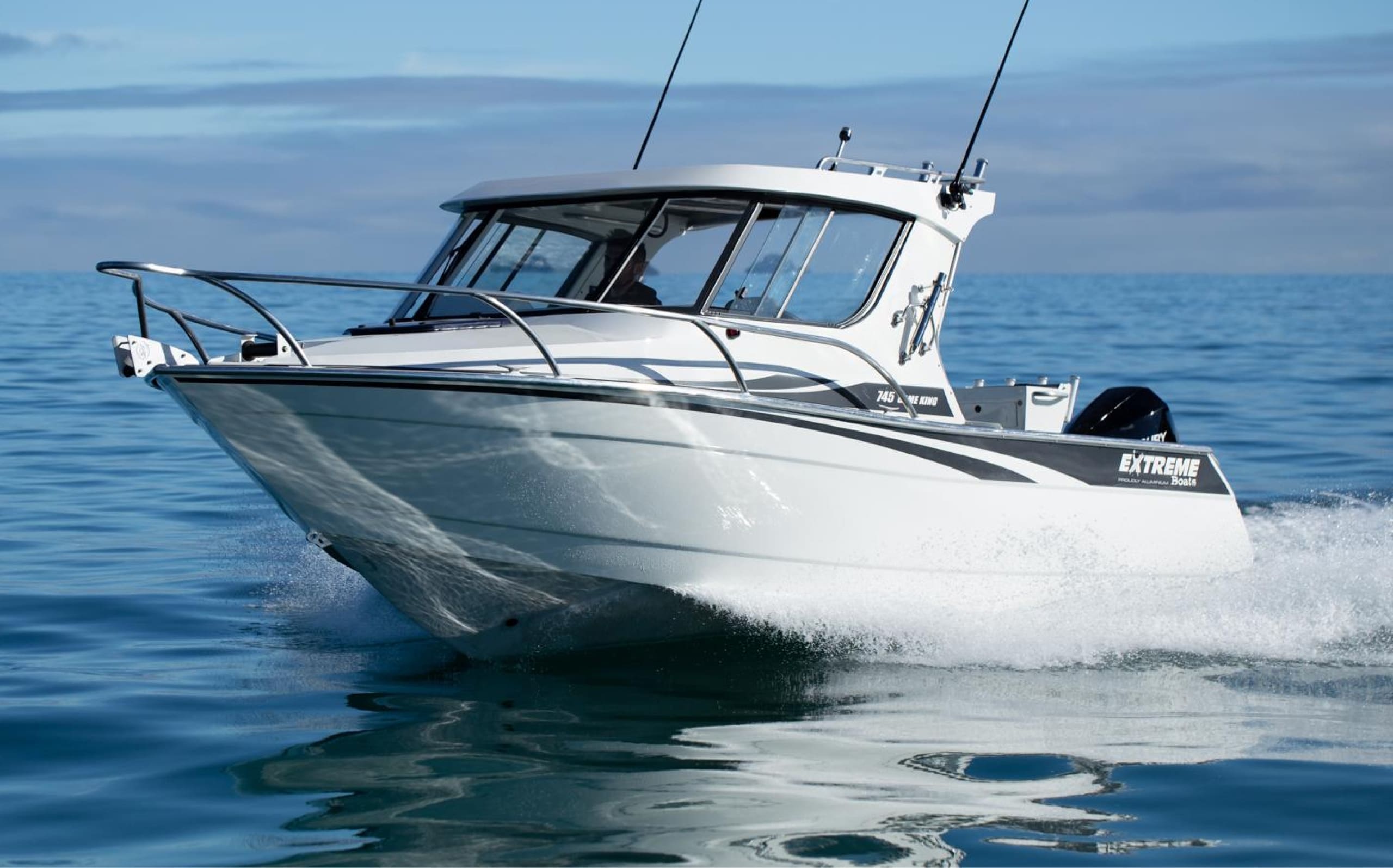 Small boat on blue water and blue sky